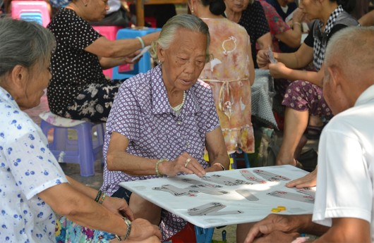 Elderly gather up to play card games