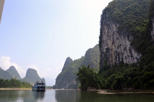 Impressive karst mountains in comparison with a boat