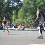 People playing streethockey in the parks