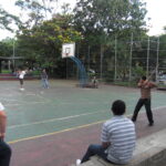 Guys playing an alternative baseball game